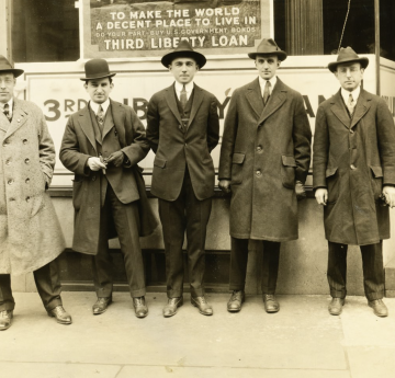 Osborn and other professionals dressed in coats and hats side by side 