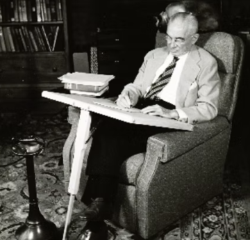 Osborn at one legged writing desk