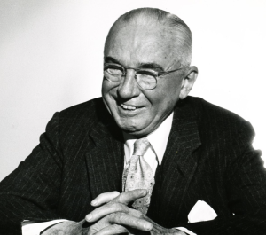 Black and white photo of alex osborn smiling