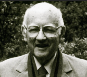 black and white profile of Torrance smiling 