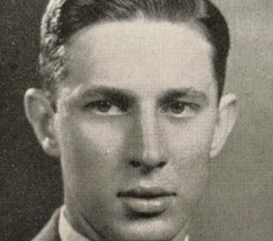 Moore in black and white head shot 