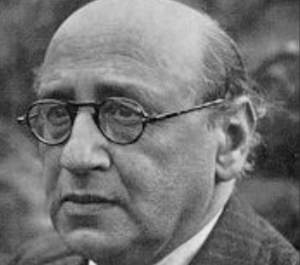 Theodore looking to the side with a subtle frown 