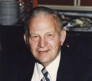 Older Gowan smiling in colored profile