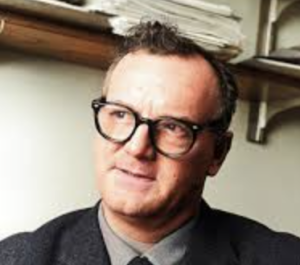 colored headshot of Mills looking to the side