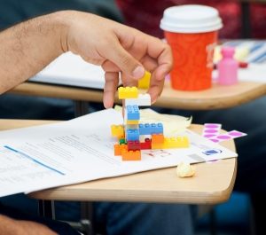 Creativity student stacking Legos